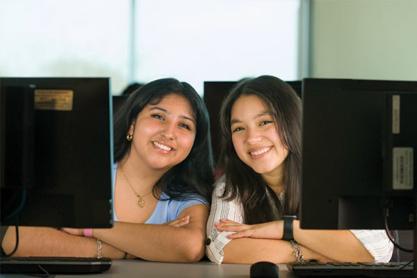 Information Technology students sitting at computers