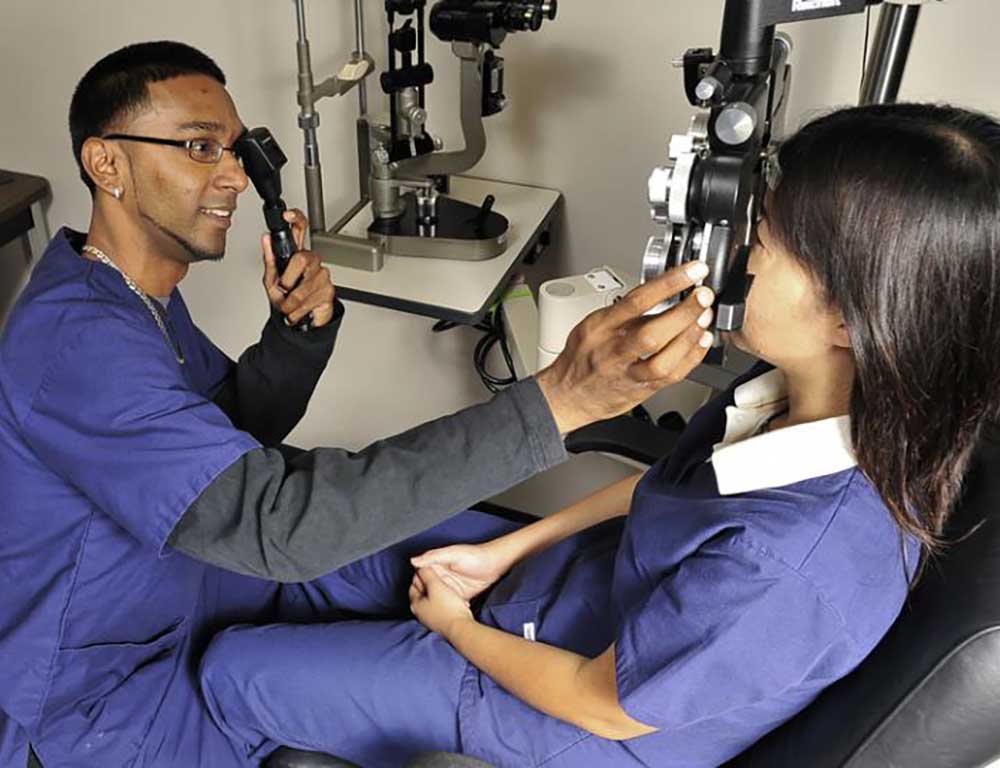 Eye Care Technology student performing an exam
