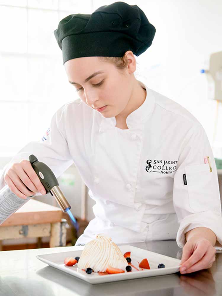 culinary student flaming dessert